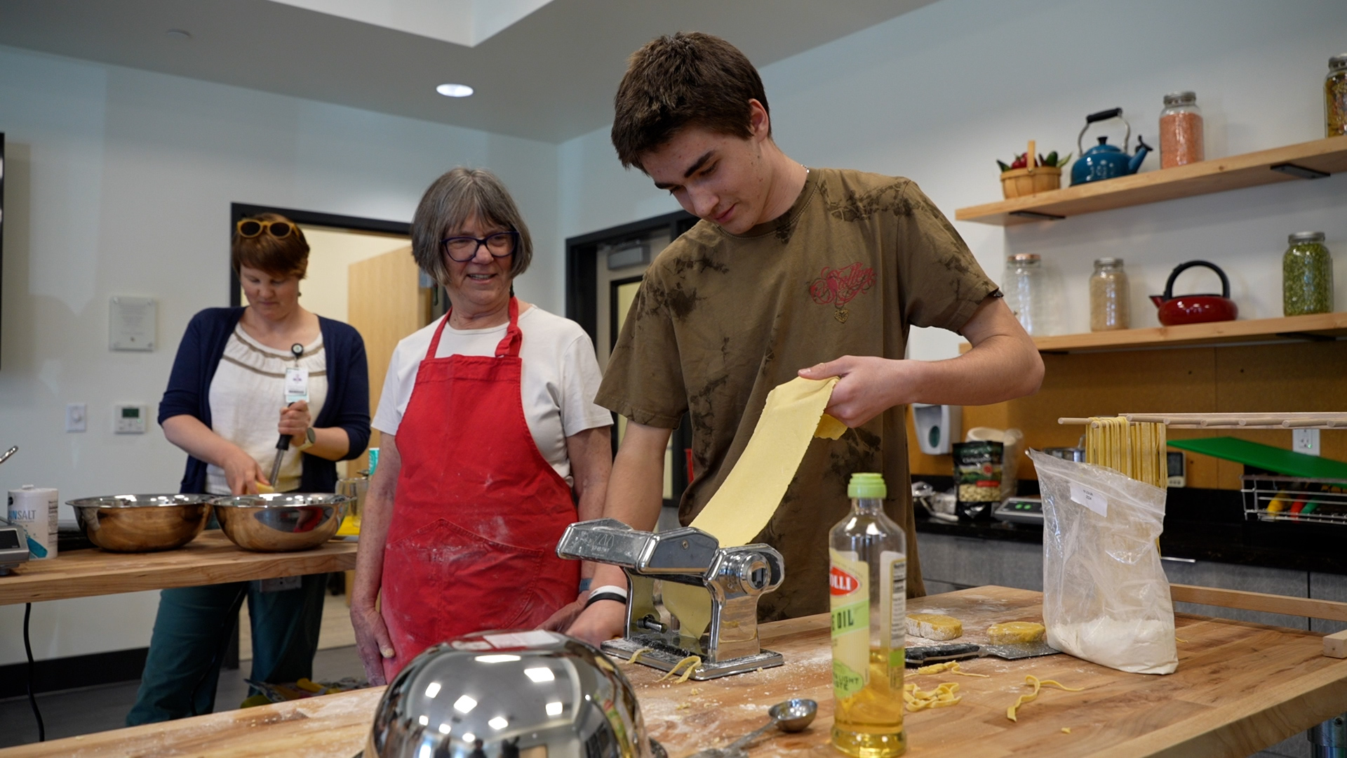 Student rolling pasta