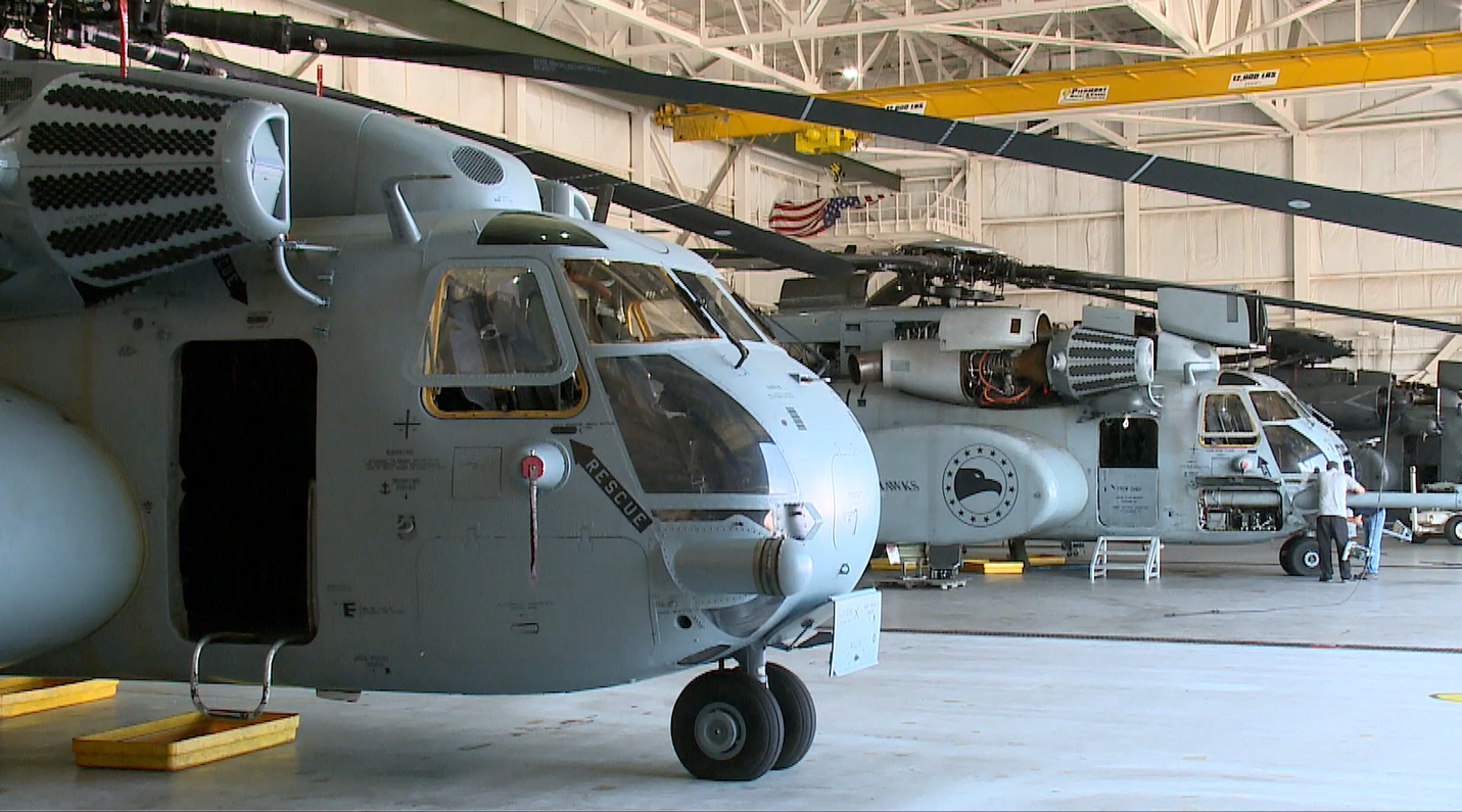 MH-53 Sea Dragon helicopters sit in the hangar of HM-15 on Naval Station Norfolk.png