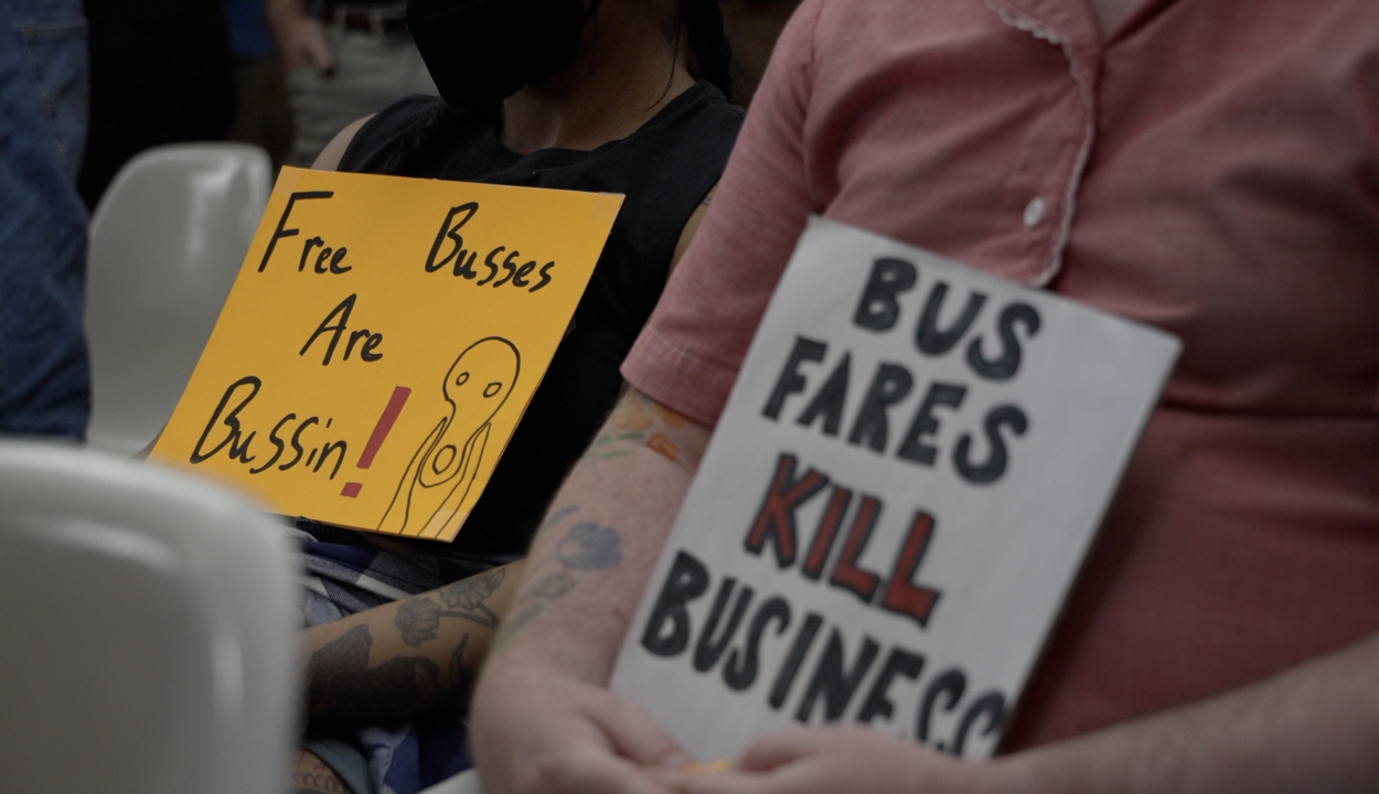 pro-free-fare signs at tucson council meeting