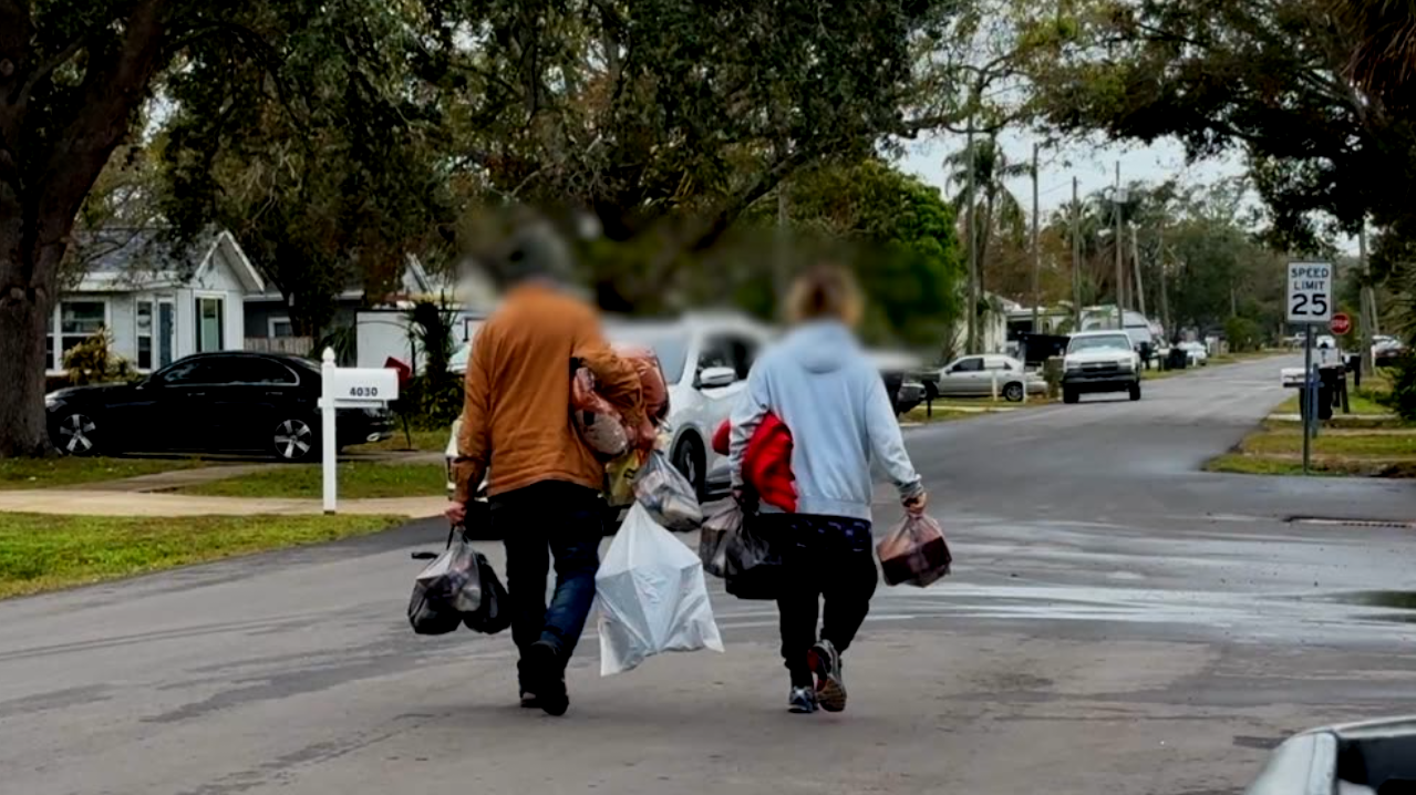 Visitors to Florida Dream Center walk through neighborhood