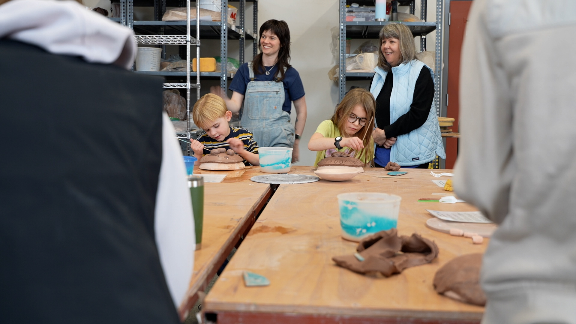 Kids making bowls 