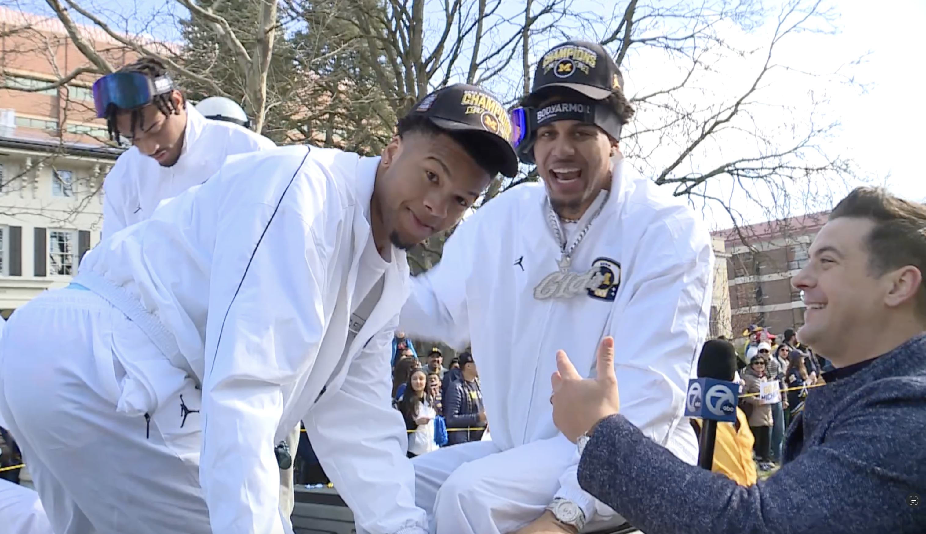 Michigan’s Yaxel Lendeborg and Trey McKenney talk with Brad Galli at the national championship parade on April 11, 2026