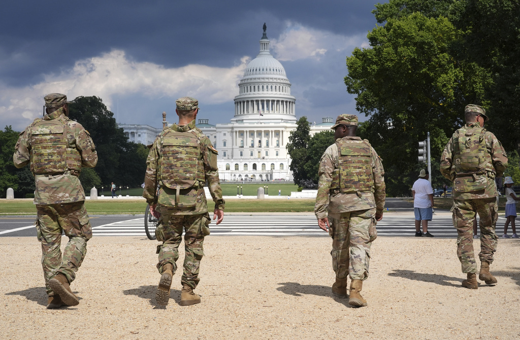 District of Columbia National Guard soldiers patrol on the National Mall, Thursday, August 14, 2025, in Washington.