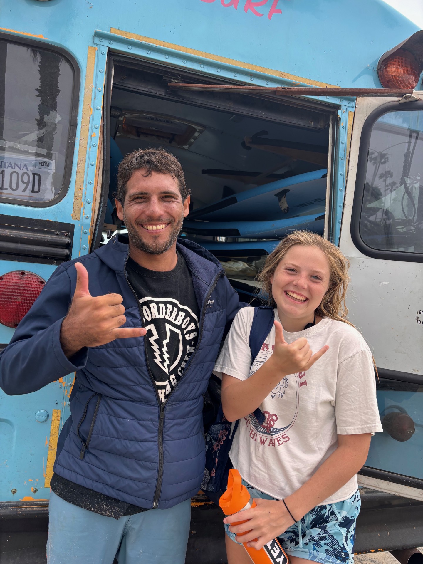 Anna Weber, 14, with her adaptive surfing instructor in Venice Beach, California.