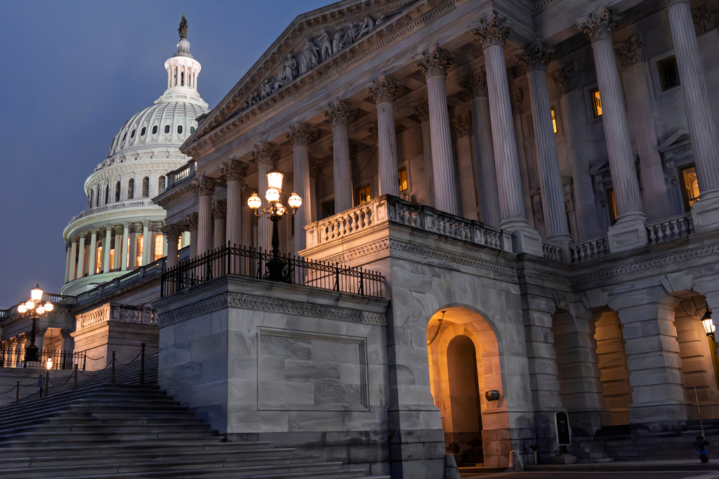 The Senate and the Capitol Dome are illuminated in Washington, early Thursday, April 2, 2026, as Congress meets in a short, pro forma session. 