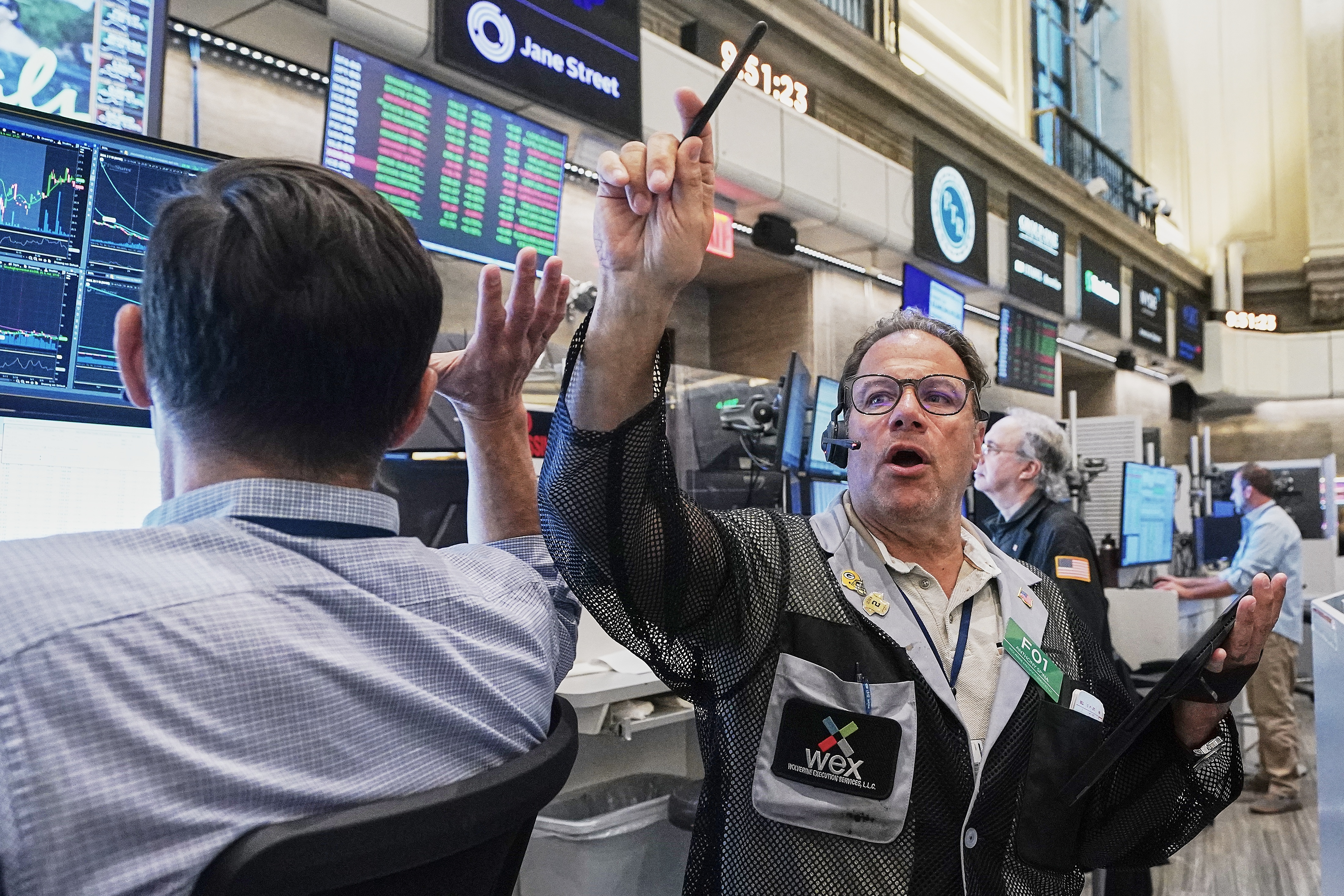 Options trader Anthony Spina, center, works on the floor of the New York Stock Exchange on June 16, 2026.