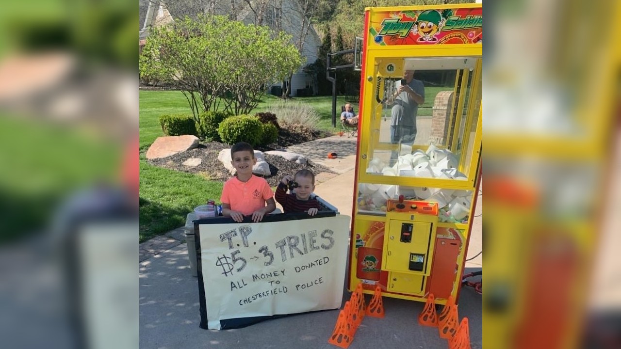 Boys set up claw machine filled with toilet paper to support police during pandemic