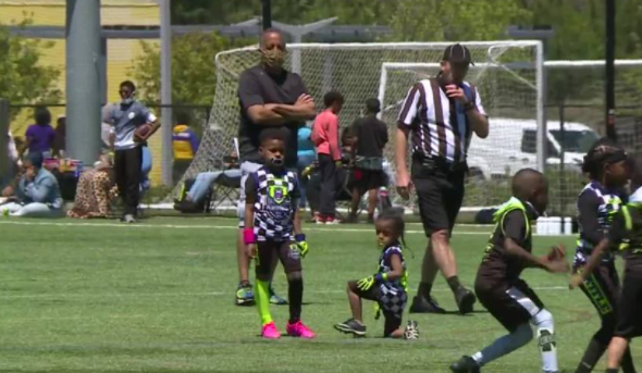 Youth football coach combines his love for the sport and his community through fundraising