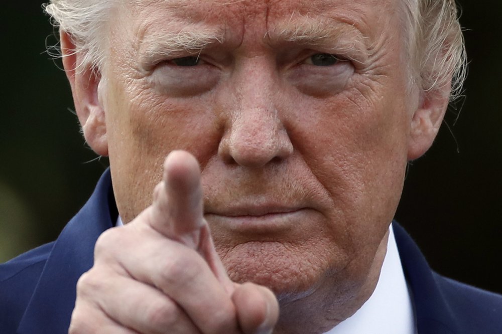 President Donald Trump points to a reporter for a questions as he speaks with reporters on the South Lawn of the White House before departing, Friday, July 19, 2019, in Washington. (AP Photo/Alex Brandon)