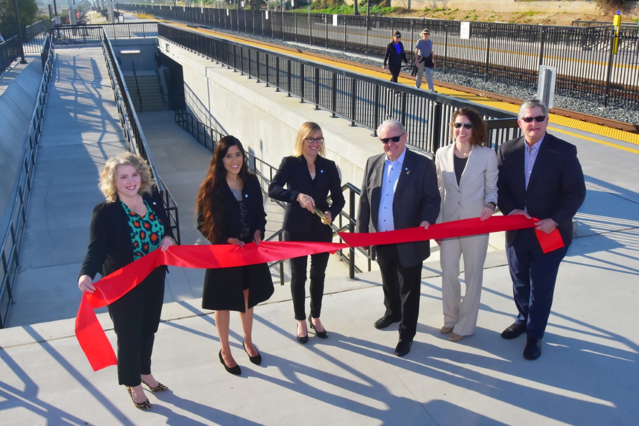 County leaders cut ribbon on Carlsbad Poinsettia Station