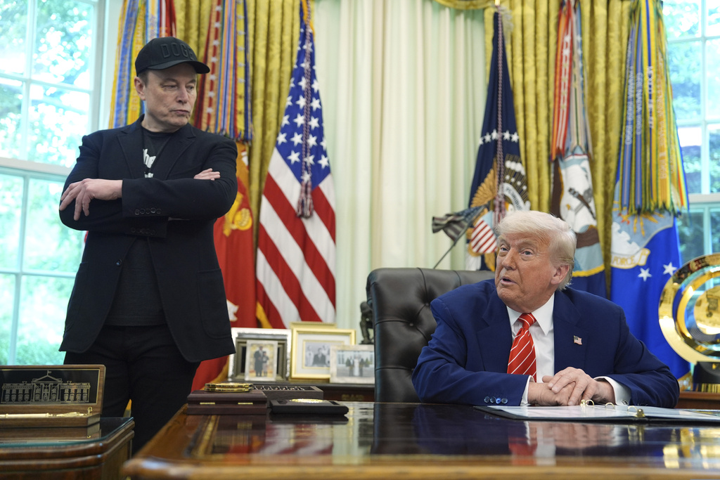 President Donald Trump, right, speaks during a news conference with Elon Musk in the Oval Office of the White House.