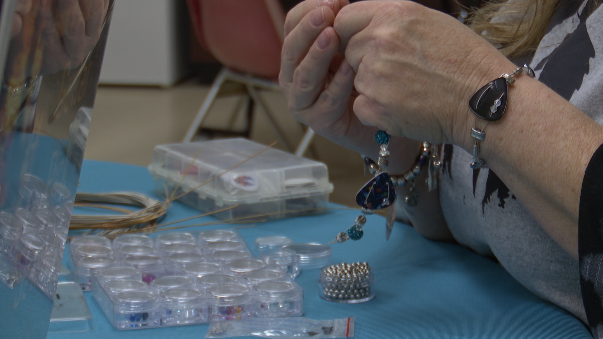 Linda crafting a bracelet