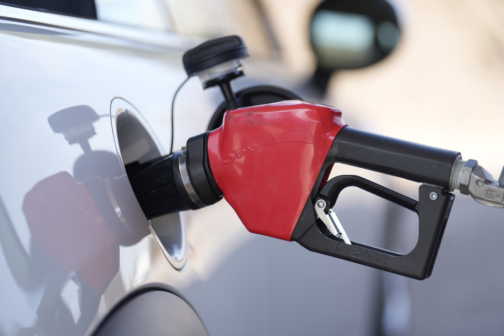 A motorist fills up the tank of a vehicle.