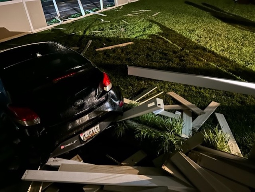 CAR THROUGH FENCE.jpg