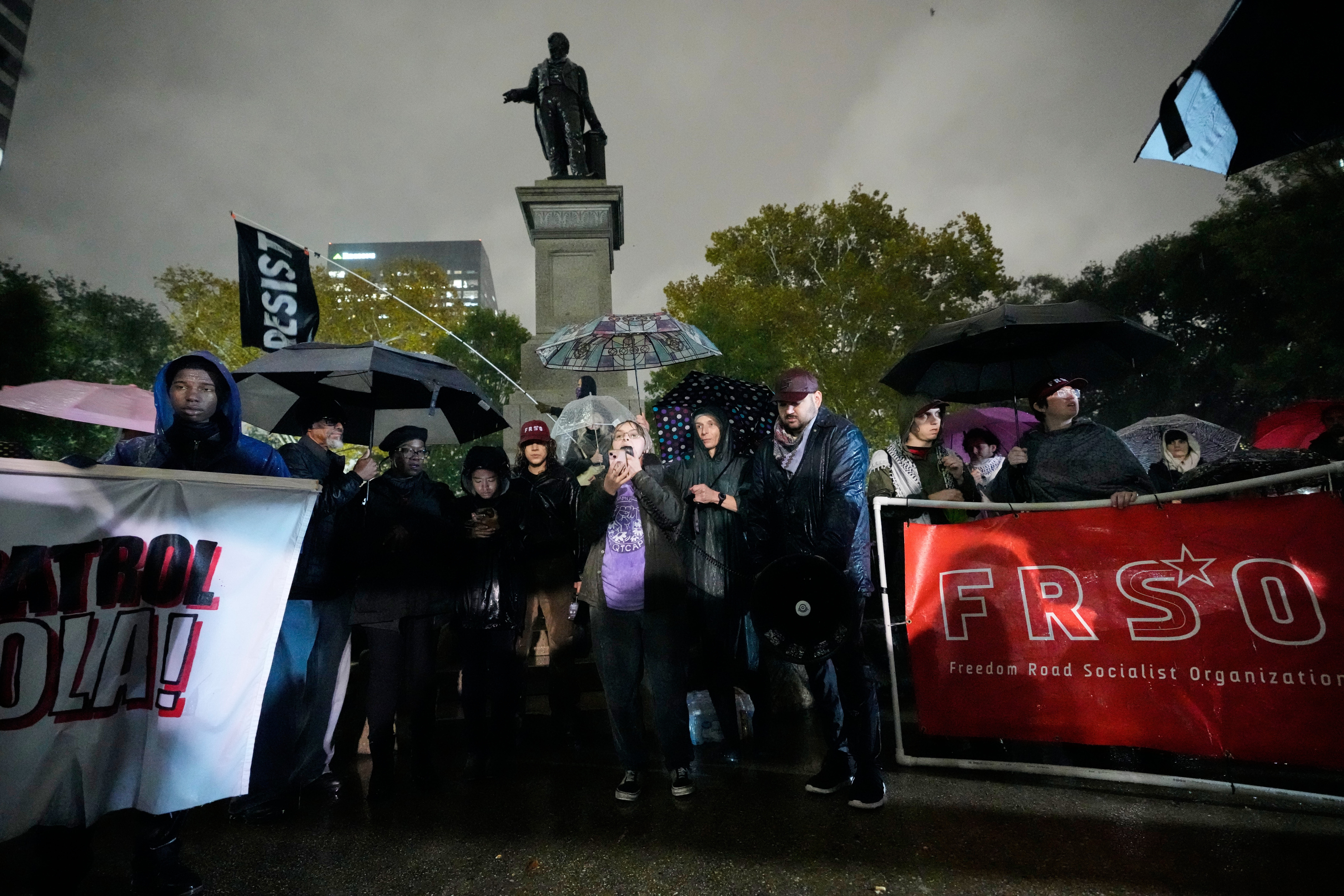Blu DiMarco, of the Queer and Trans Community Action Project, speaks at a protest against an impending Customs and Border Patrol immigration crackdown effort in New Orleans, Monday, Dec. 1, 2025. 