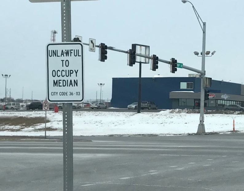 Median ordinance sign 108 and l st