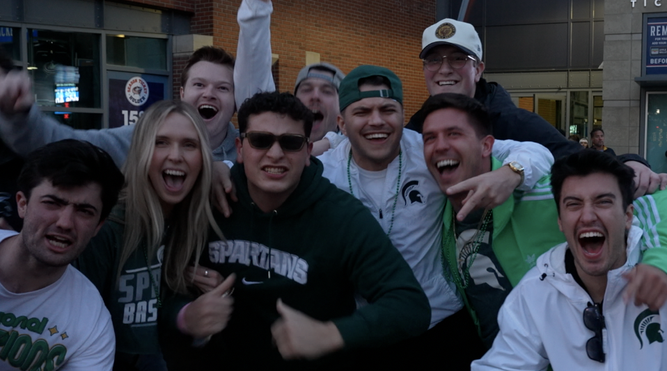 MSU fans cheering outside of Nationwide Arena after MSU's win against Marquette Sunday