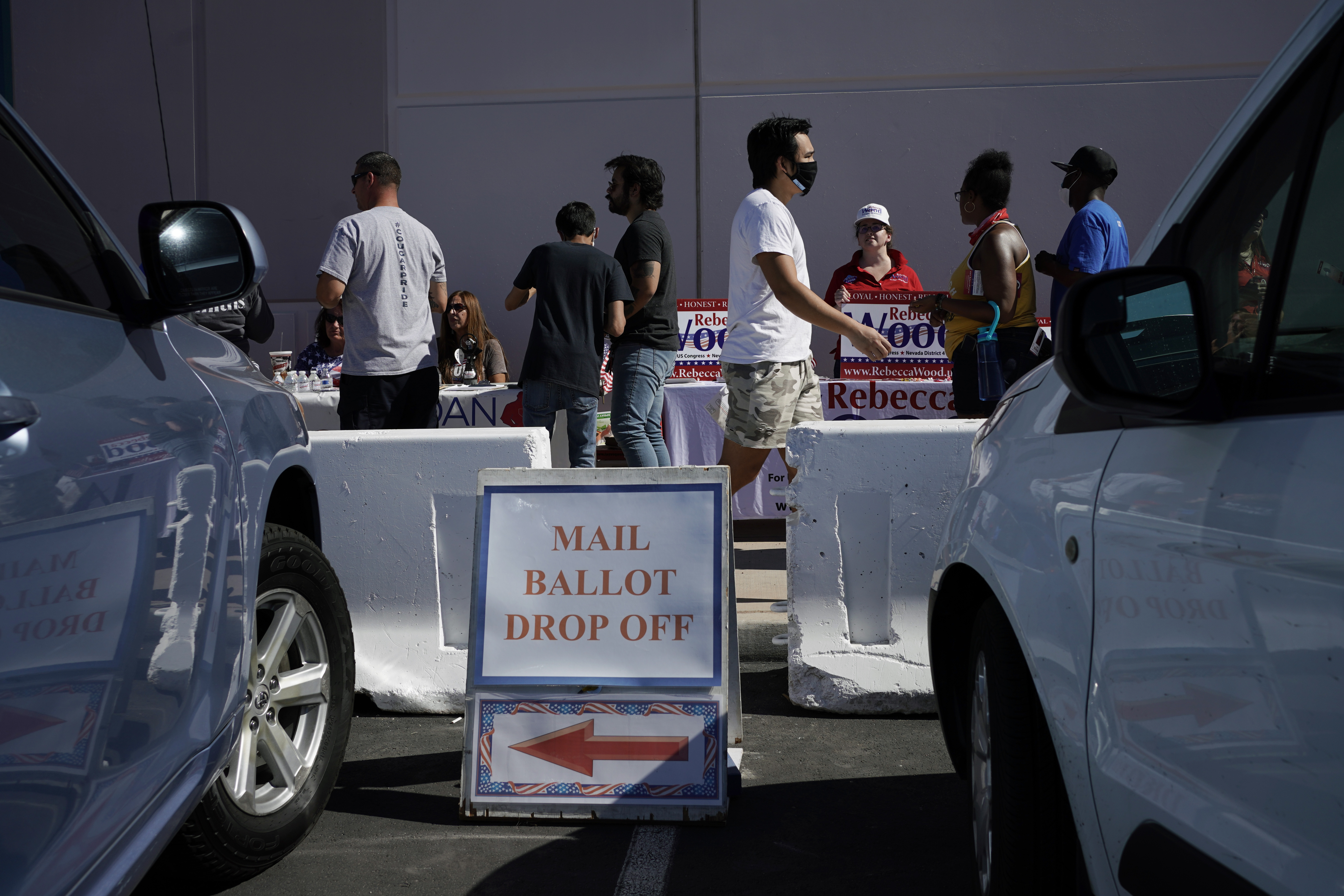 How to be safe at the polls when socially-distanced lines put voters in the path of electioneers
