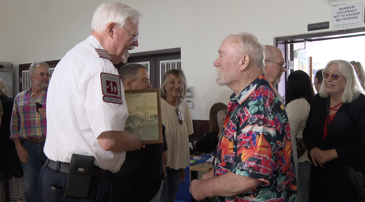 Anderson connecting with people at his retirement party. 