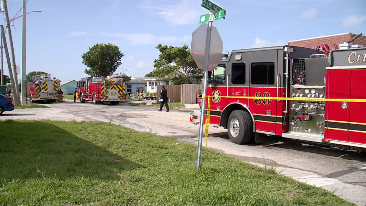 Crews investigate a fatal fire near the intersection of Blue Heron Boulevard and Avenue E on Sept. 5, 2024.