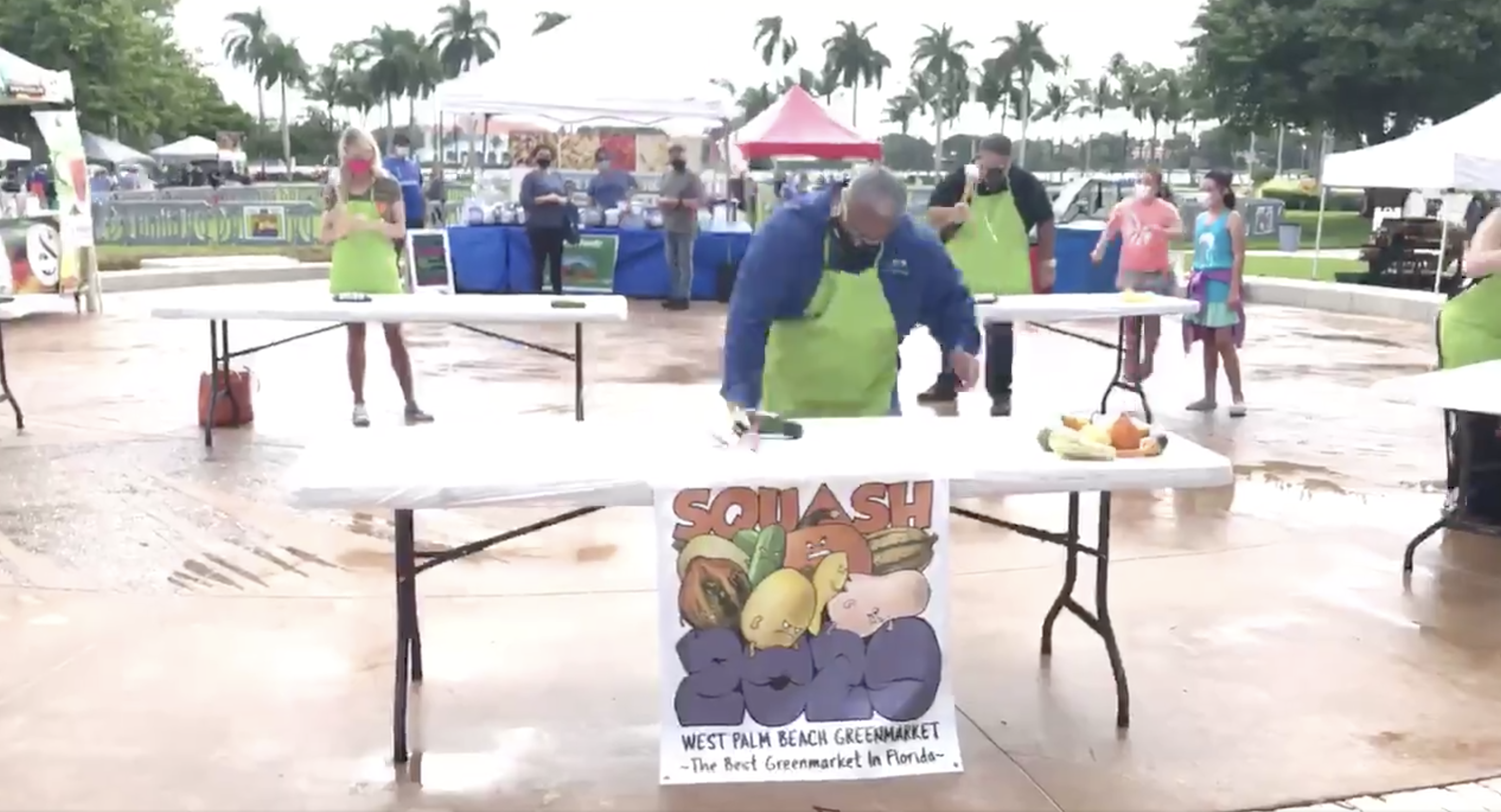 Mayor Keith James takes a mallet to a piece of squash.  Him and city commissioners want to "Squash 2020."