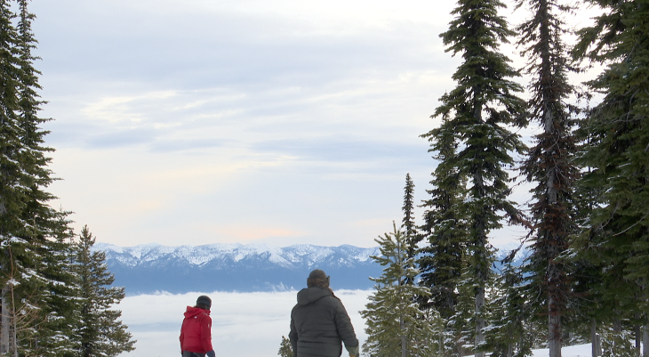Two snowboarders ride down a run at Blacktail Mountain, Lakeside