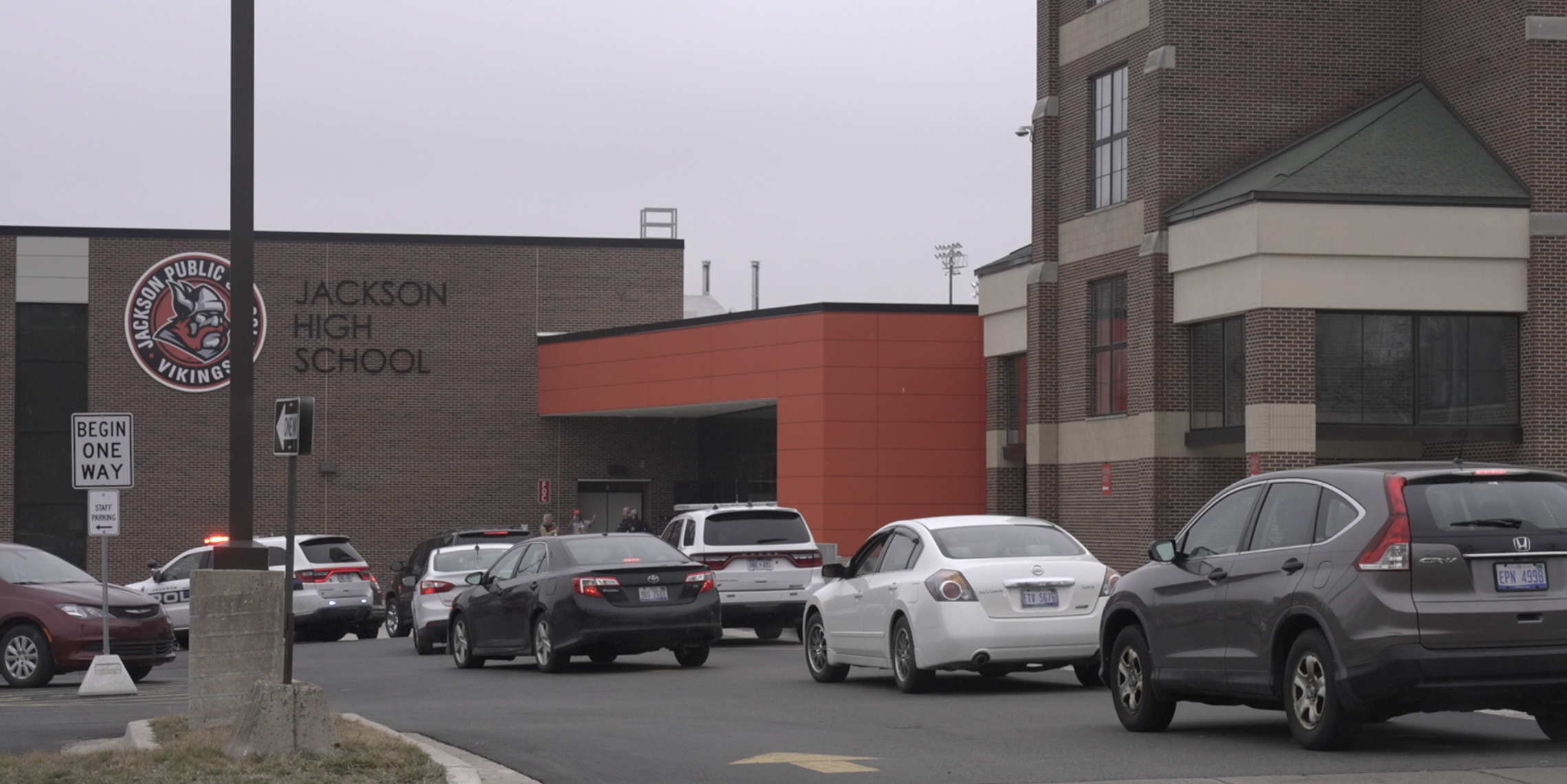 Parents line up at Jackson High School as police stand by