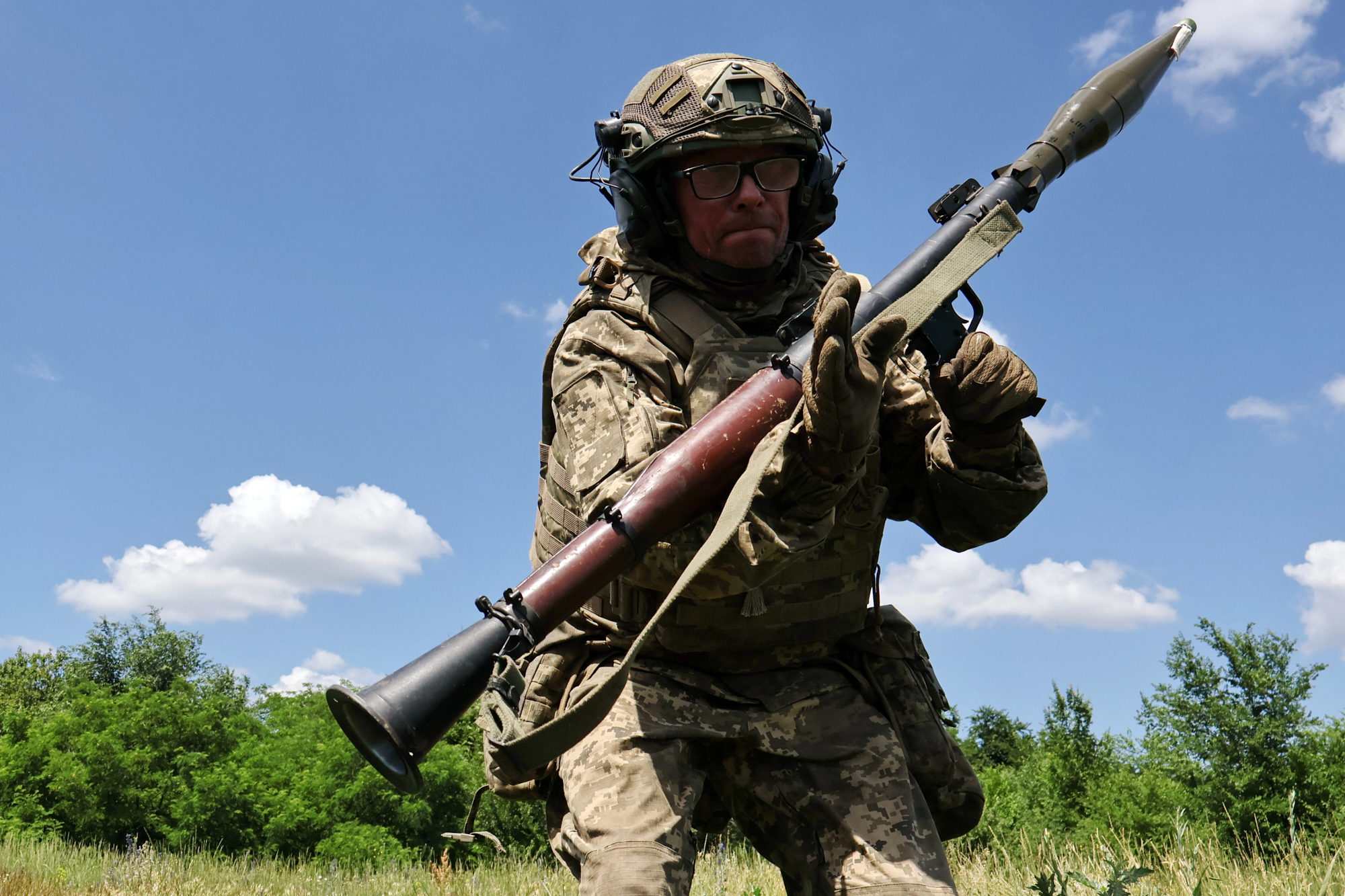 In this photo provided by Ukraine's 65th Mechanized Brigade press service, a soldier practices military skills at a training ground near the frontline in the Zaporizhzhia region, Ukraine, Saturday, June 20, 2026.