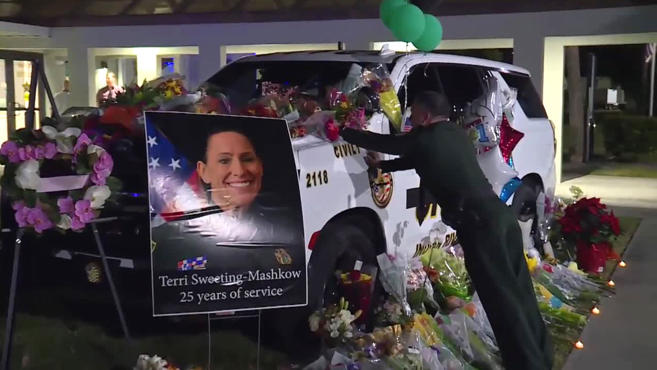 A growing memorial for Deputy Terri Sweeting-Mashkow stands outside the Indian River County Sheriff's Office.