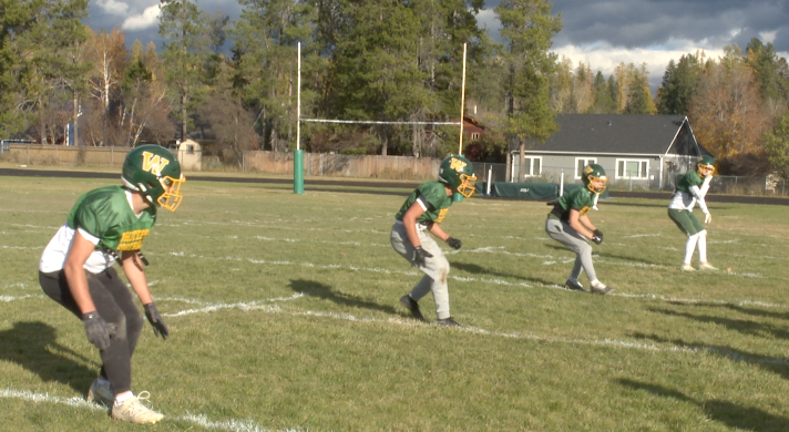 Whitefish defensive backs lined up for drill at practice, Whitefish