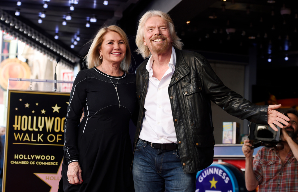 British business magnate Richard Branson, right, appears with his wife Joan Templeman Branson during a ceremony honoring him with a star on the Hollywood Walk of Fame, in Los Angeles, Oct. 16, 2018.