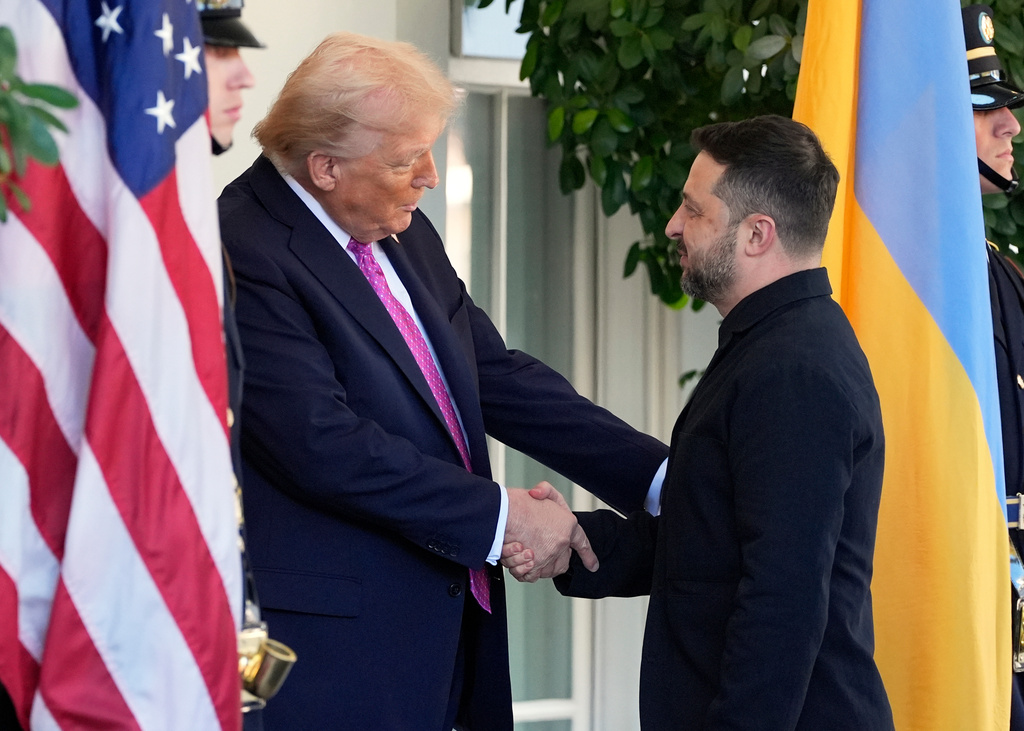 President Donald Trump, left, greets Ukraine's President Volodymyr Zelenskyy at the White House, Friday, Oct. 17, 2025, in Washington.