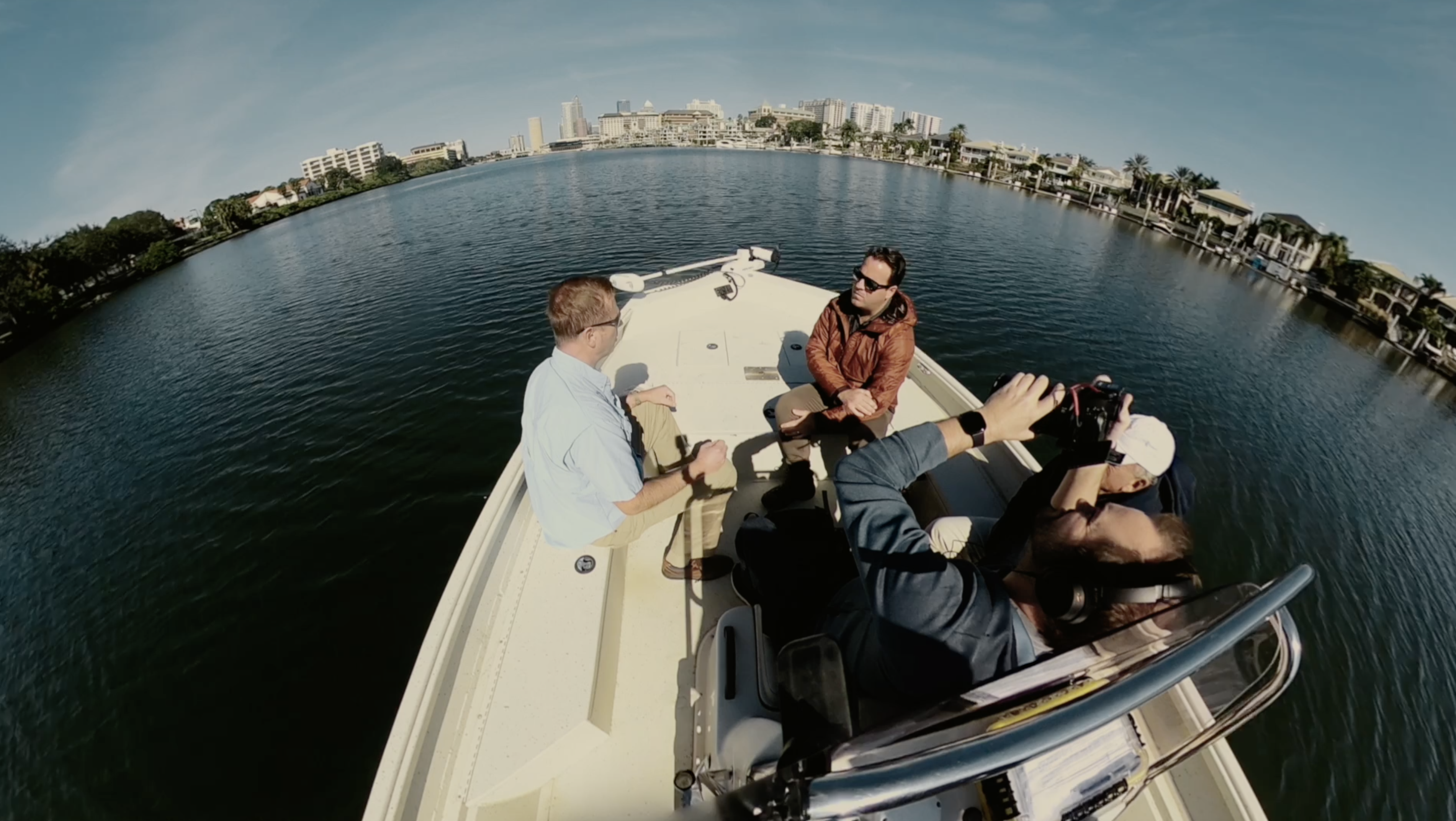 Reporter Michael Paluska and photographer Reed Moeller on the Hillsborough River with scientists tracking pollution.