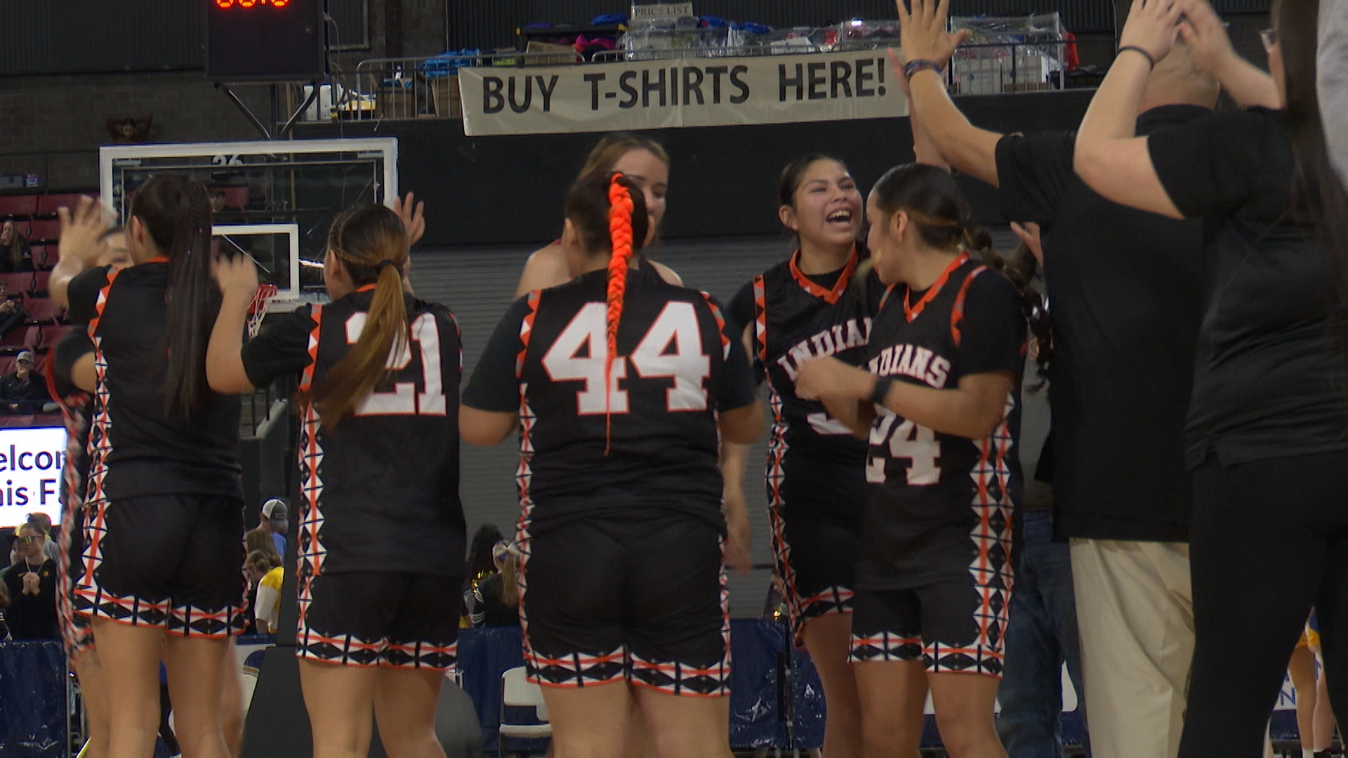 Kloe celebrates with team after close game. 