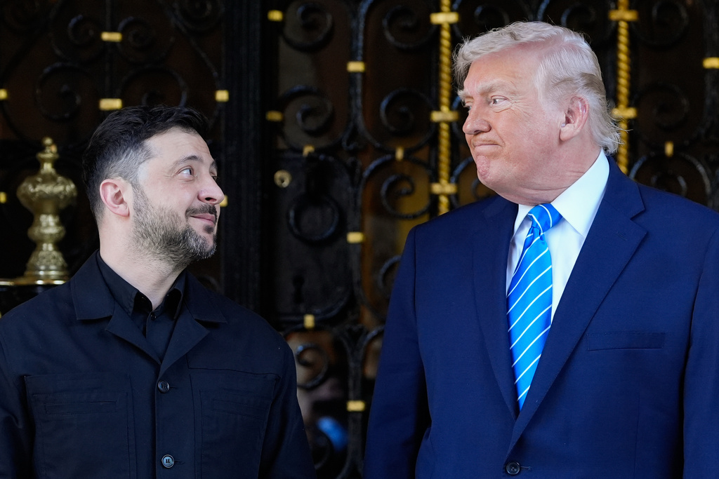 FILE - U.S. President Donald Trump greets Ukrainian President Volodymyr Zelenskyy at his Mar-a-Lago resort in Palm Beach, Florida, Dec. 28, 2025. 