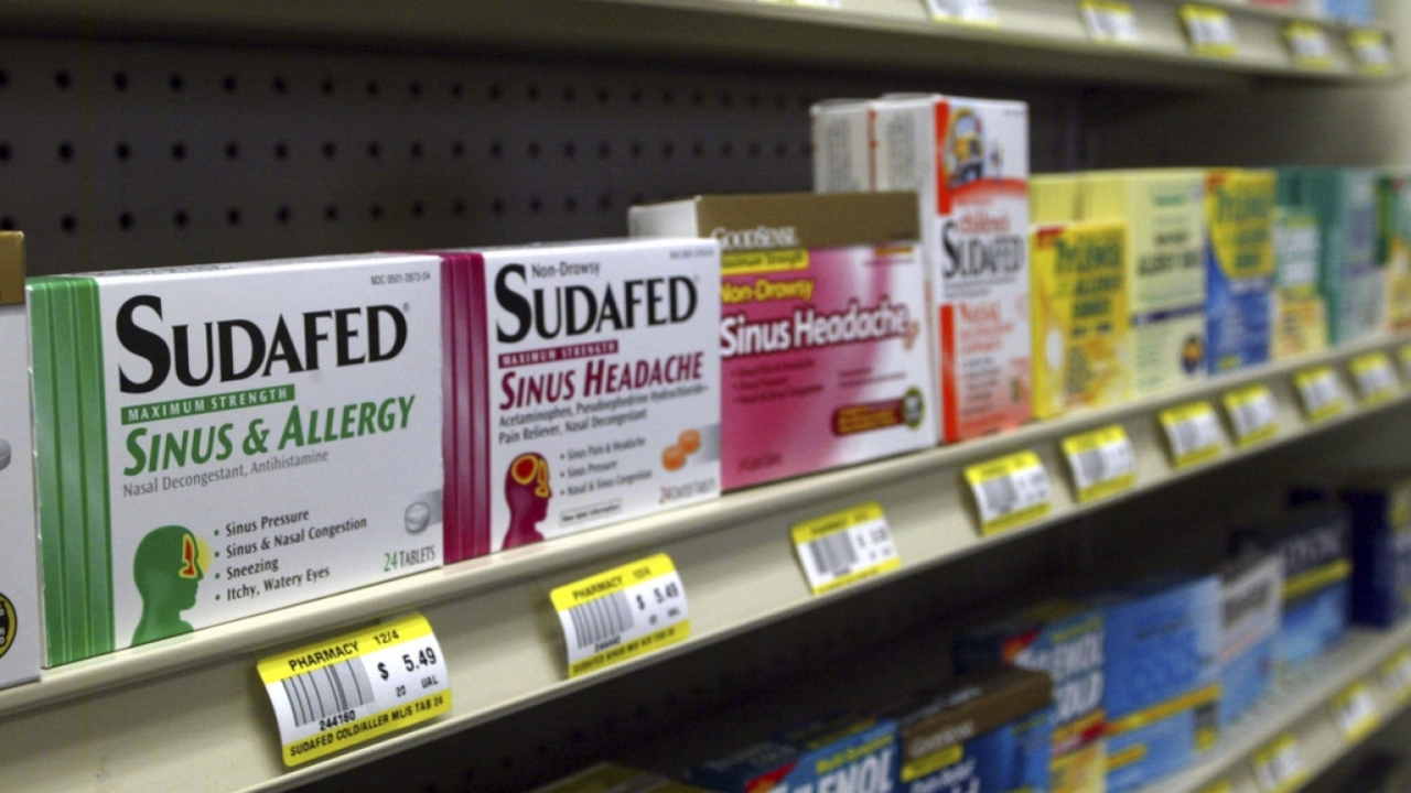 Sudafed and other cold and flu products on a shelf.
