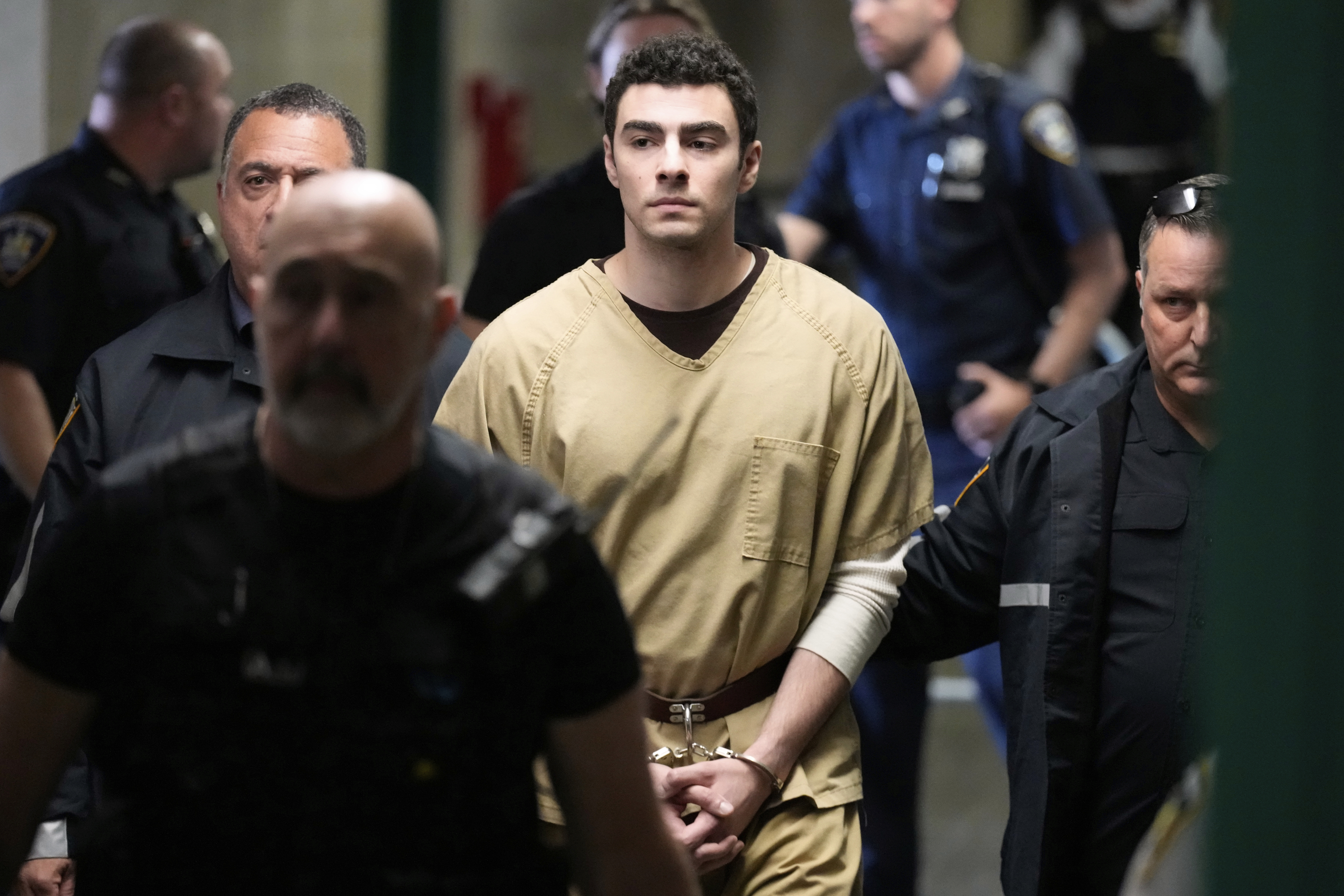 Luigi Mangione is escorted into Manhattan state court in New York, Tuesday, Sept. 16, 2025.