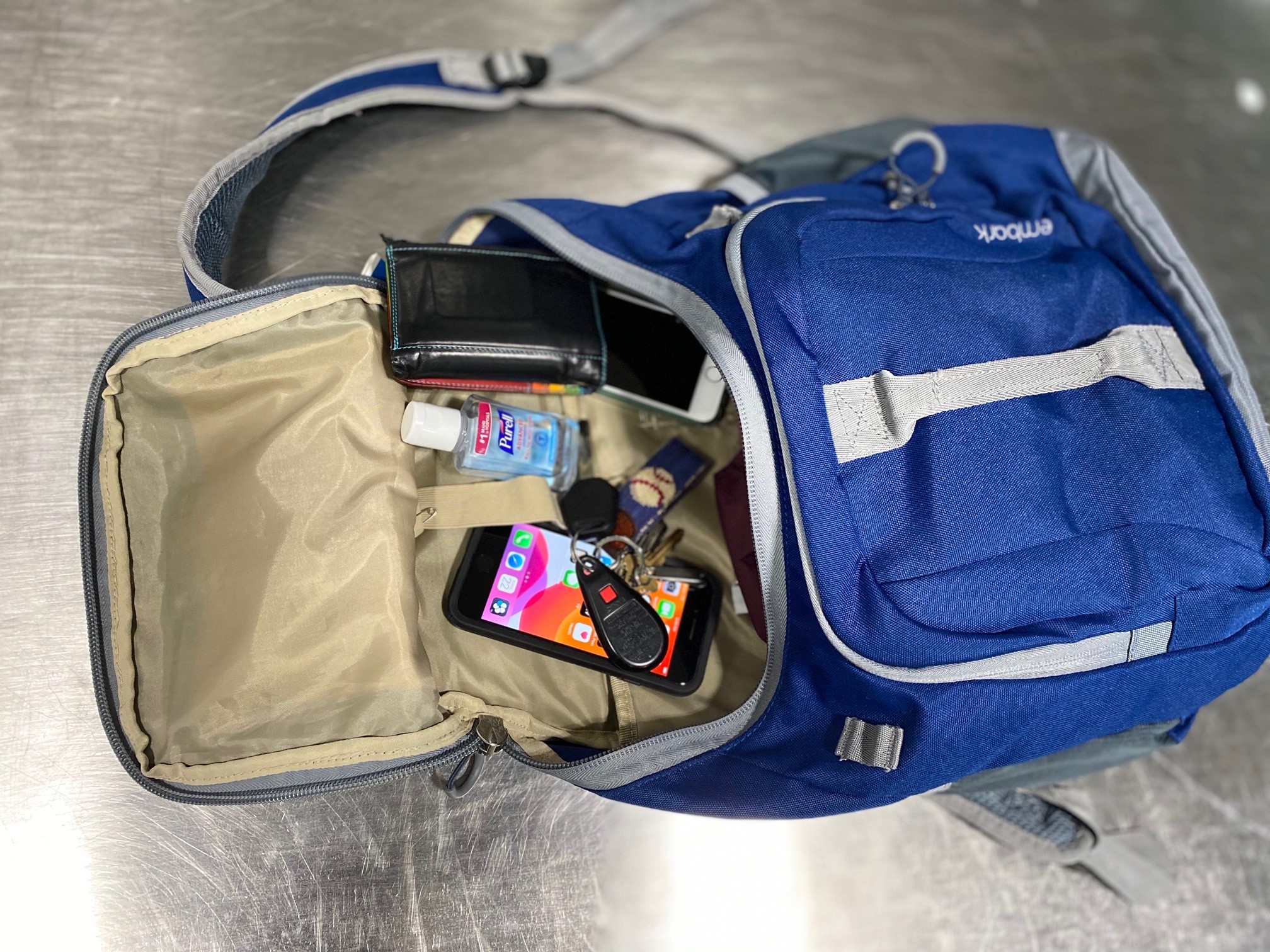 Knapsack with items from pockets inside.jpg
