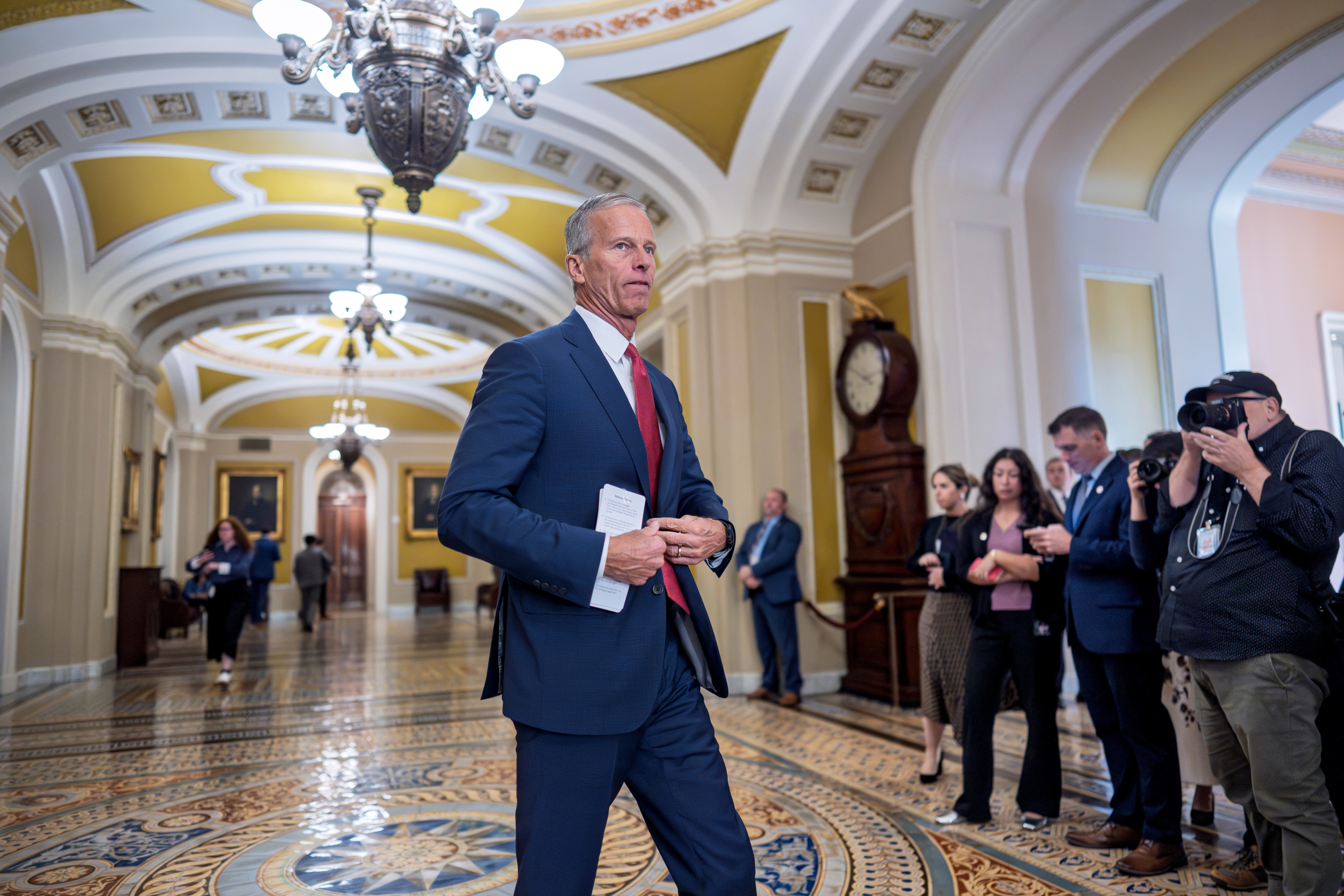 Senate Majority Leader John Thune, R-S.D., arrives to speak with reporters following a closed-door Republican strategy session, on day 35 of the government shutdown, at the Capitol in Washington, Tuesday, Nov. 4, 2025. 