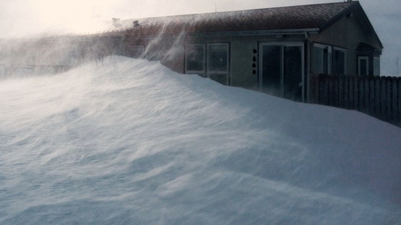Snow drifted to the roof of a house in Peyton by janine Coffman