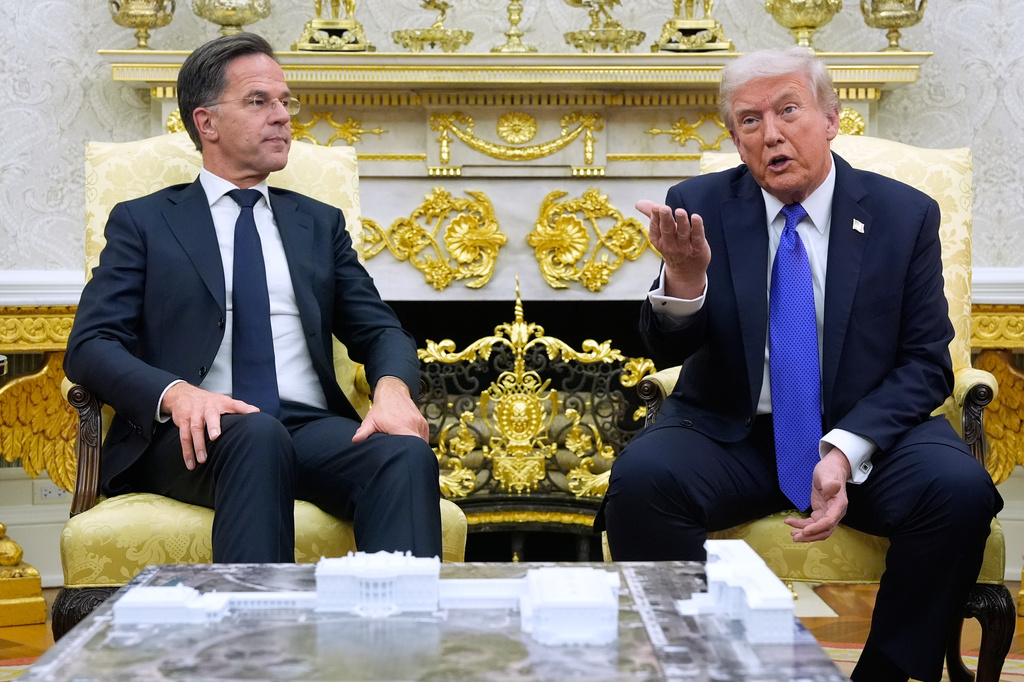 FILE - President Donald Trump meets with NATO Secretary General Mark Rutte in the Oval Office of the White House, Oct. 22, 2025, in Washington. 