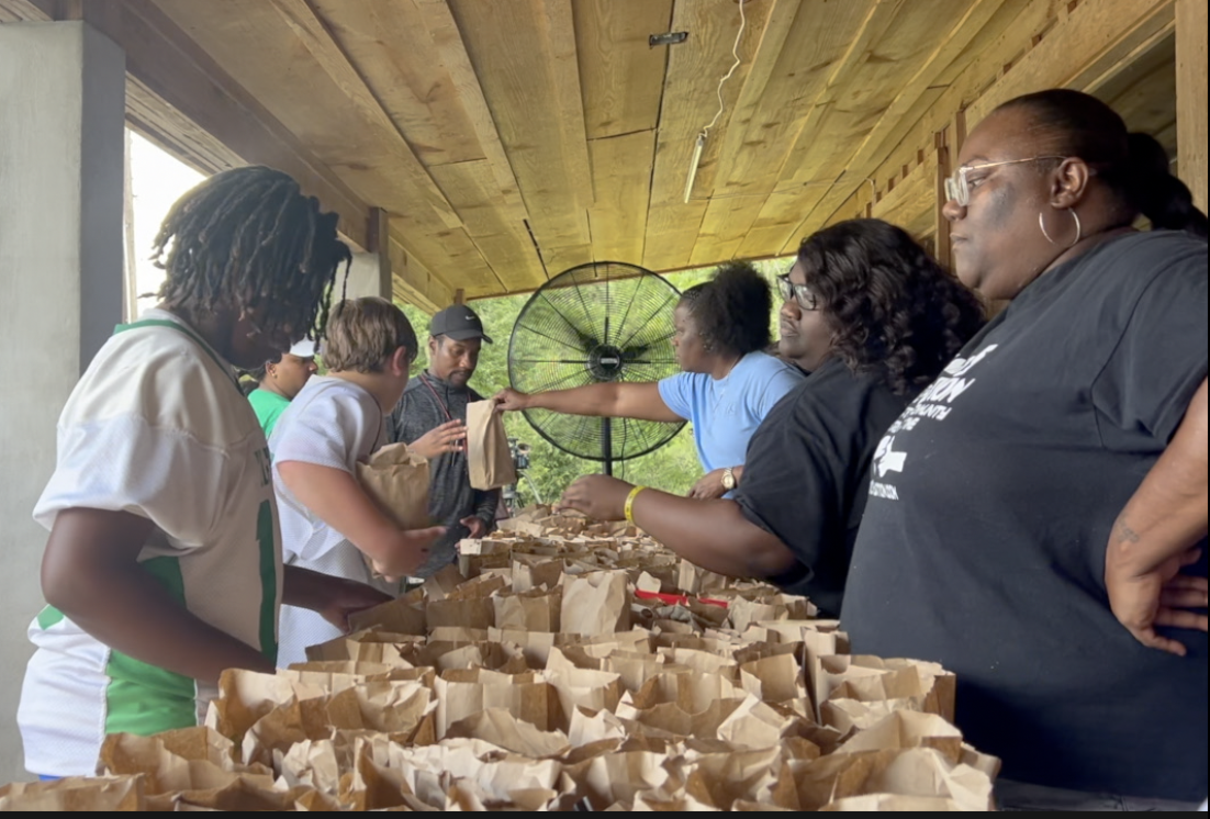 Football coaches from Washington middle school walked beside their team with a police escort just to make sure players got a bag lunch before heading back home.