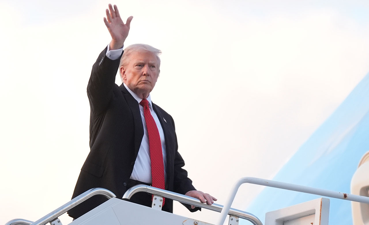 President Donald Trump waves as he boards Air Force One at Palm Beach International Airport in West Palm Beach Fla., on his way back to the White House following a weekend at his Mar-a-Lago estate, Sunday, Nov. 2, 2025. 
