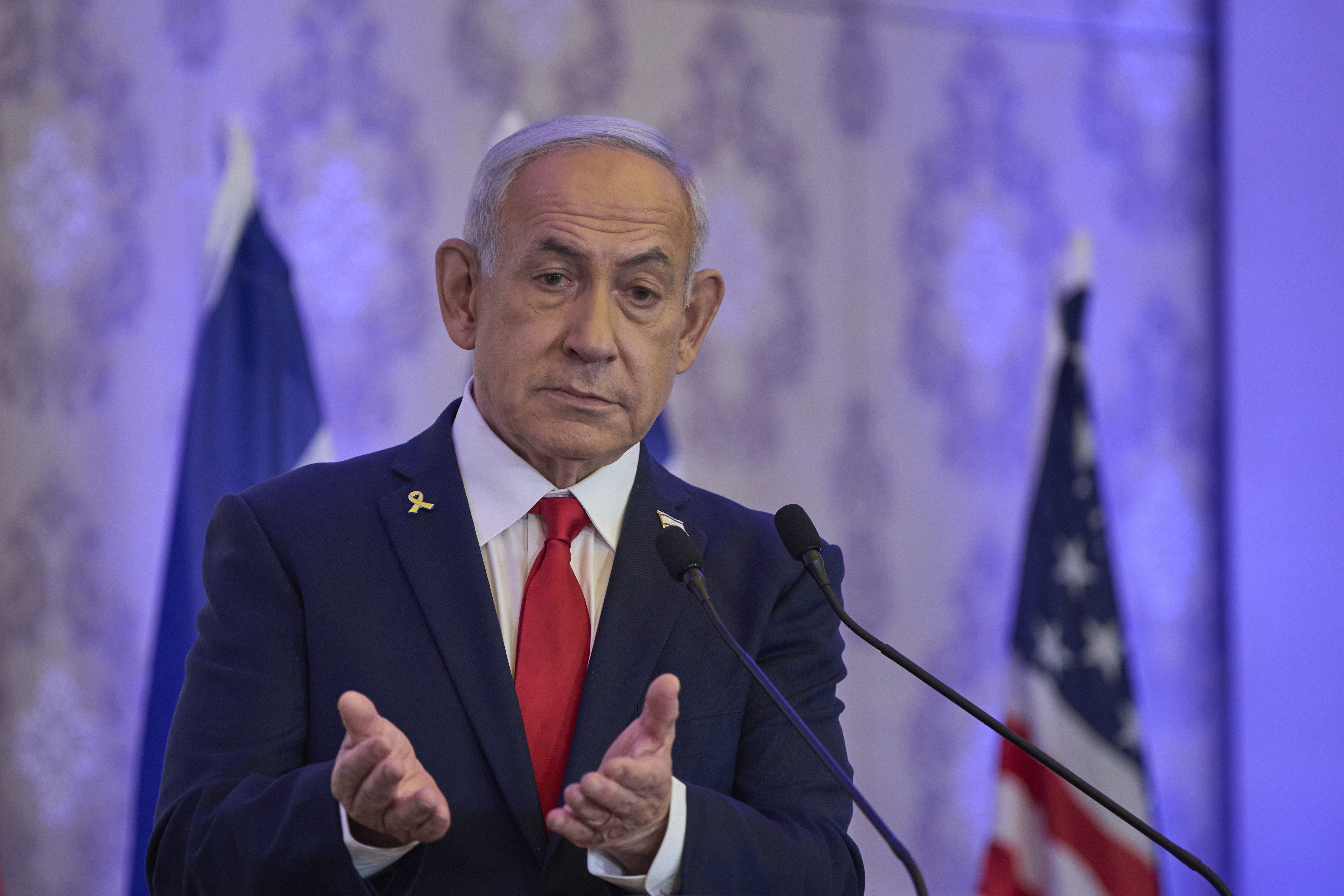 Israeli Prime Minister Benjamin Netanyahu speaks to the audience at a conference in Jerusalem, Sunday, July 27, 2025.