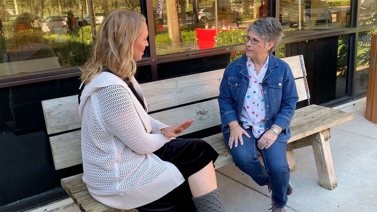 WPTV anchor Ashley Glass speaks to a local resident at a Let's Hear It community meet-up held at Palm Beach County Animal Care and Control on Dec. 16. 2025.