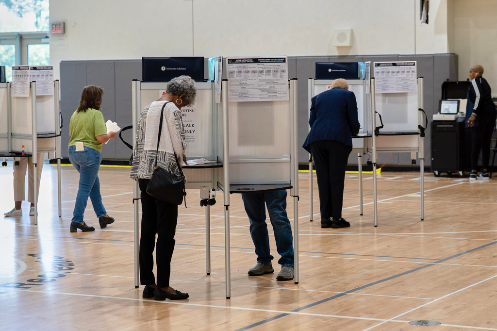 People cast their vote during D.C. primary election at Shepard Park Elementary, Tuesday, June 16, 2026, in Washington. 