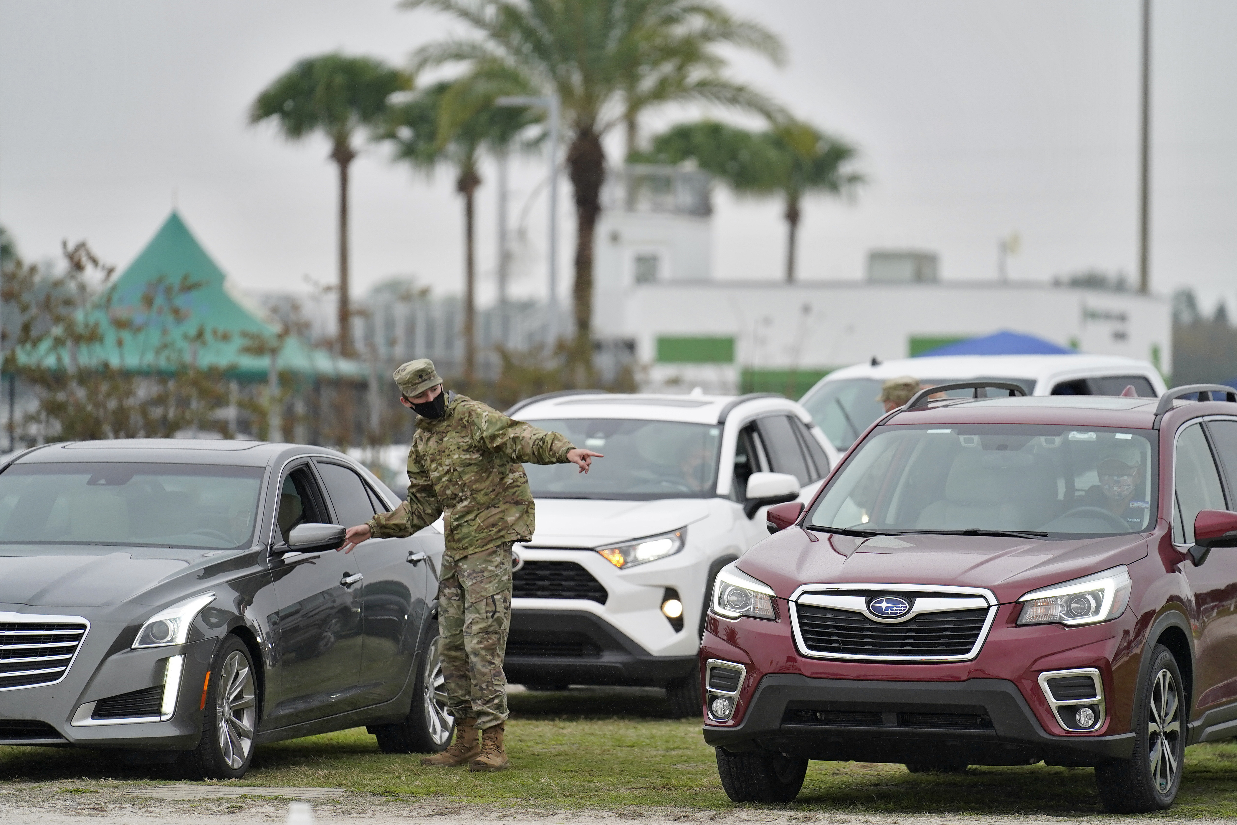 Florida National Guard directs people waiting in line for COVID-19 vaccine in Lakewood Ranch, Feb. 17, 2021