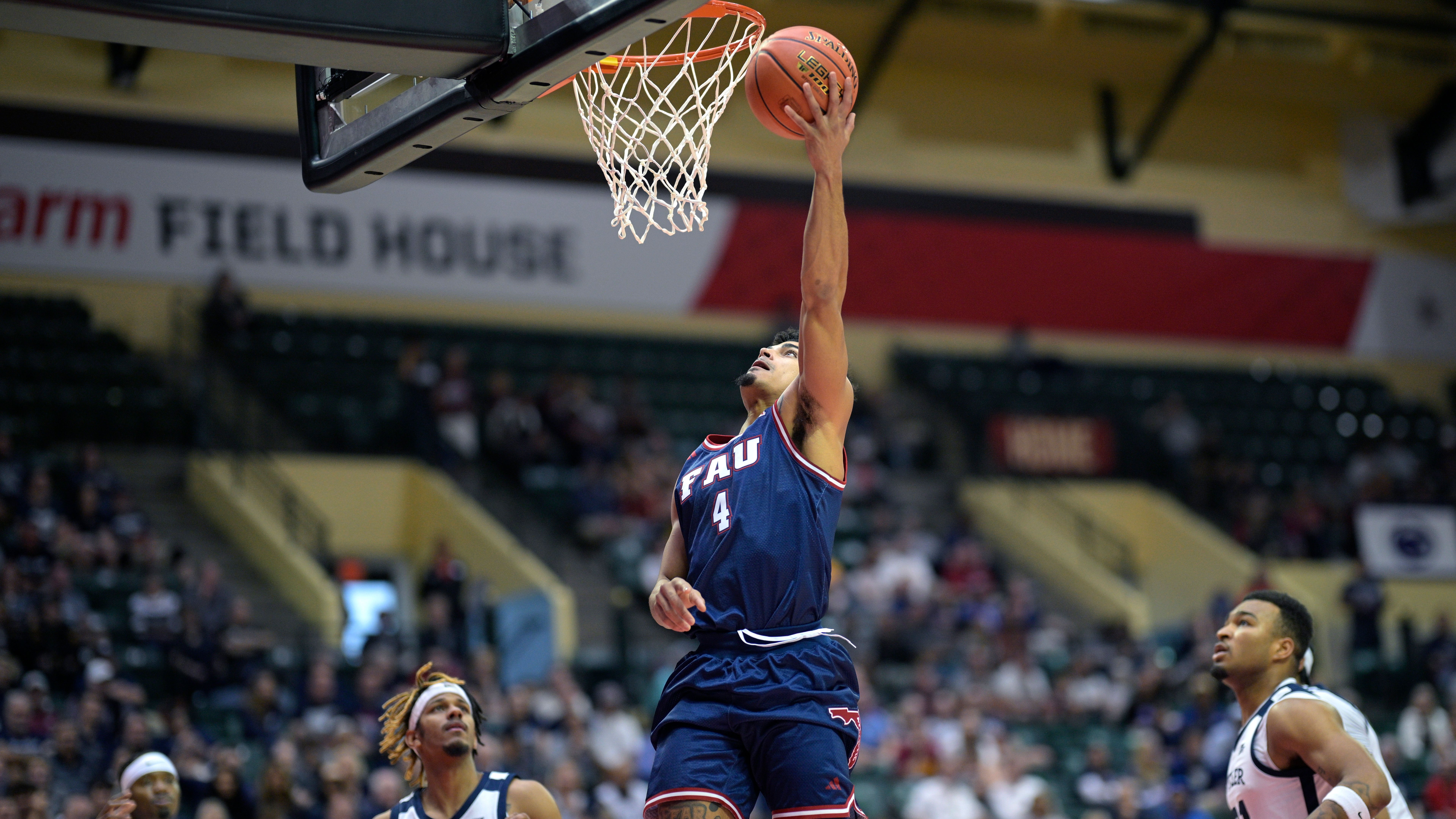 Florida Atlantic Owls guard Bryan Greenlee goes up for shot in front of Butler Bulldogs guard DJ Davis during first half, Nov. 23, 2023