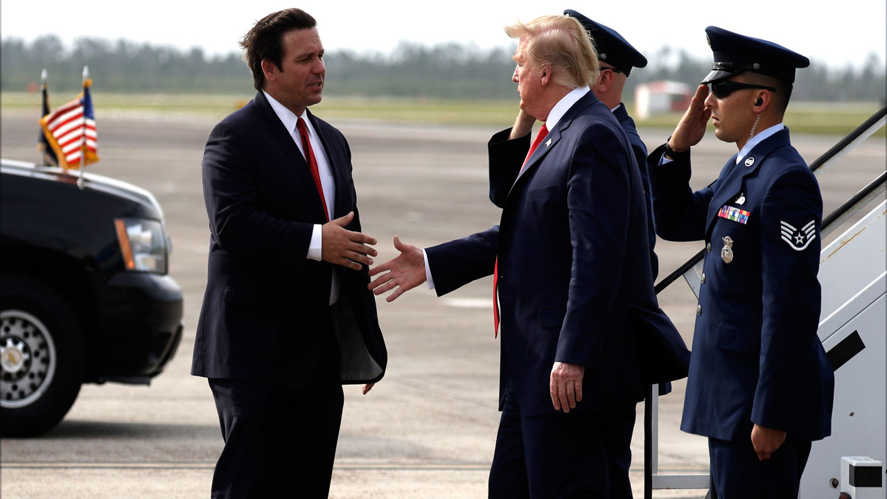 Gov. Ron DeSantis shakes hands with President Donald Trump in May 2019