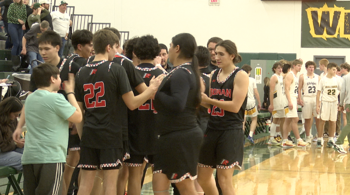 Ronan huddles after victory against Whitefish